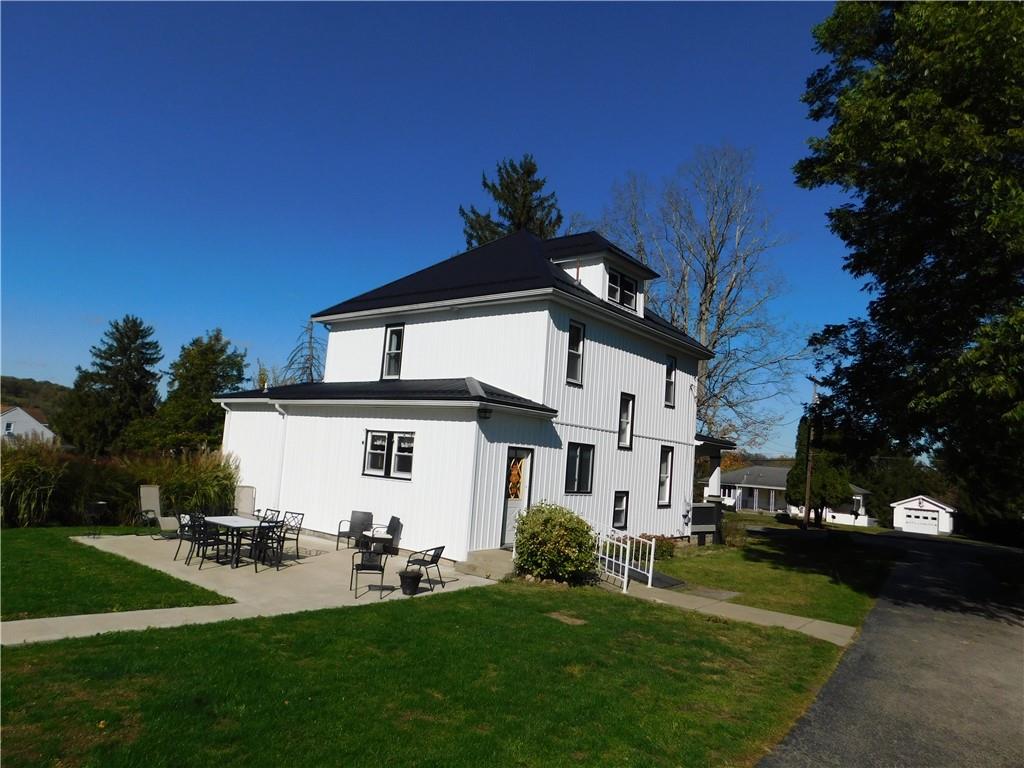 235 Ridge Road Brownsville, PA 15417 - Photo 42 of 42 a front view of a house with a garden and yard