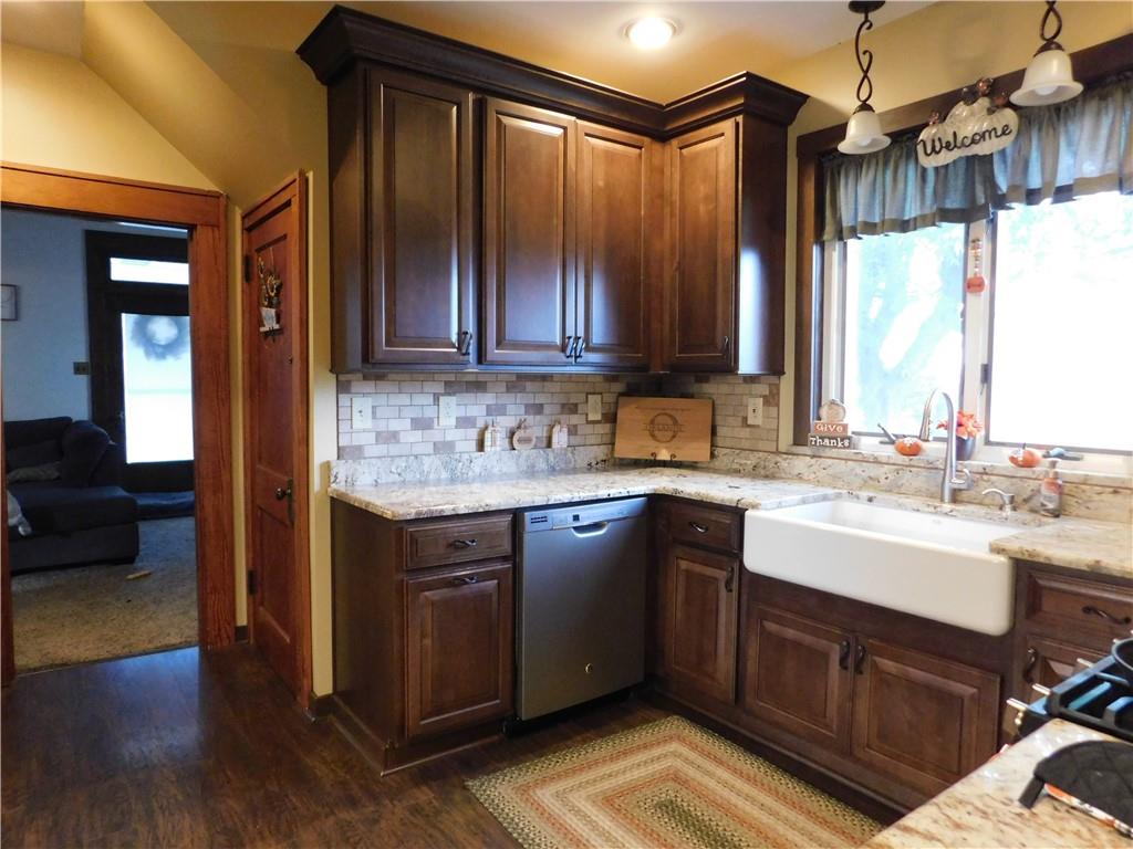 235 Ridge Road Brownsville, PA 15417 - Photo 6 of 42 a kitchen with a sink cabinets and wooden floor