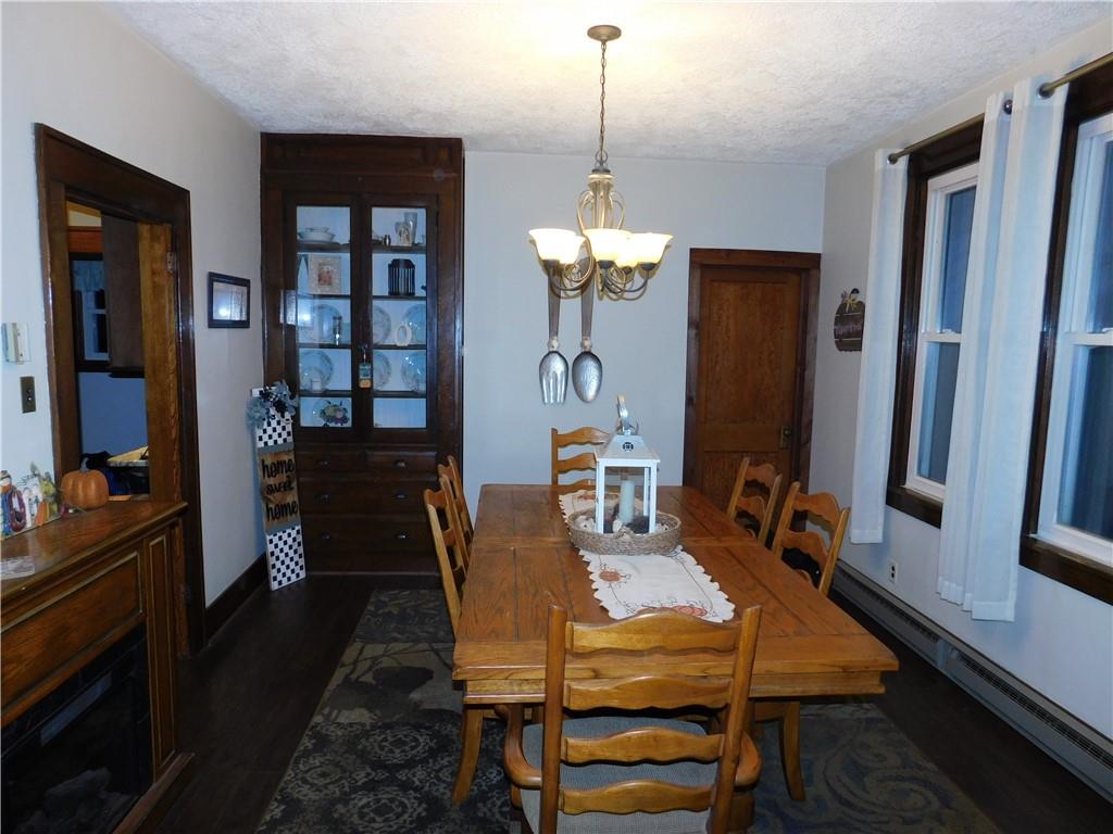 235 Ridge Road Brownsville, PA 15417 - Photo 10 of 42 a view of a dining room with furniture a rug and wooden floor