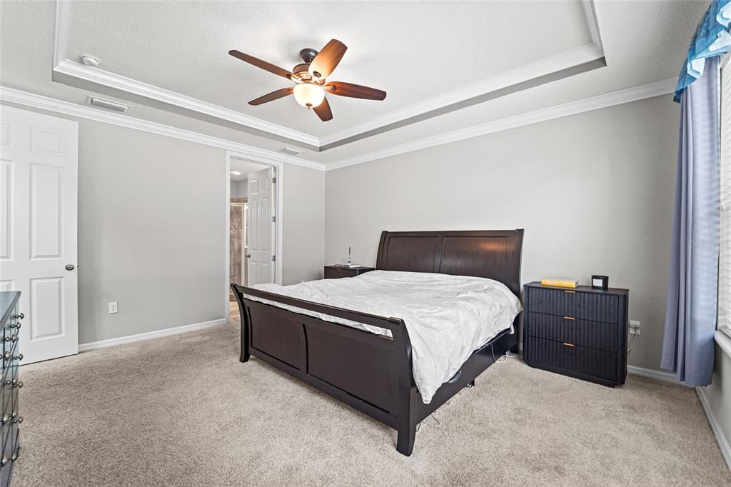 8903 Arabella Lane Seminole, FL 33777 - Photo 13 of 47 a bedroom with a bed and a ceiling fan