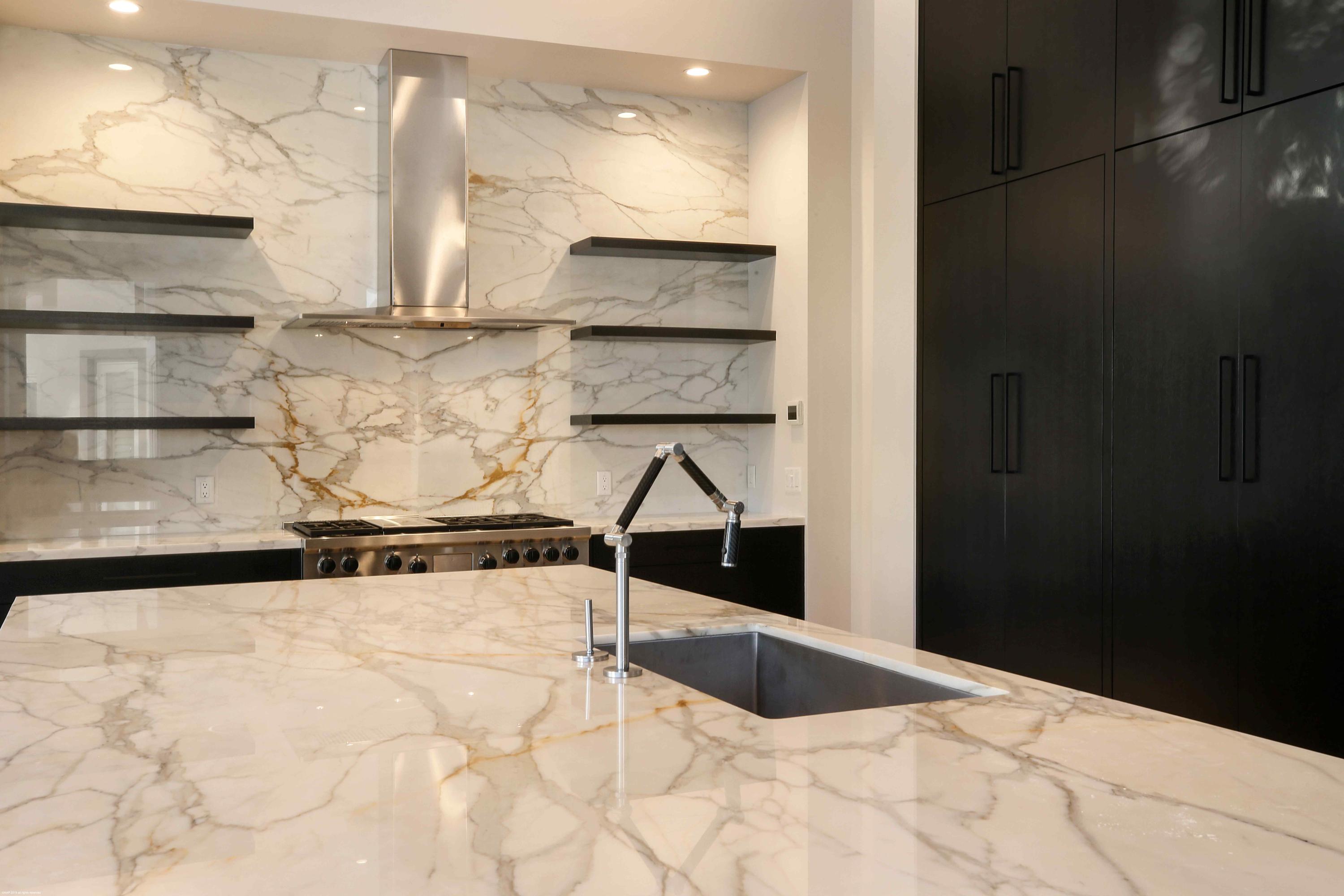 263 River Drive Tequesta, FL 33469 - Photo 24 of 68 a view of kitchen with stainless steel appliances granite countertop a refrigerator and a stove