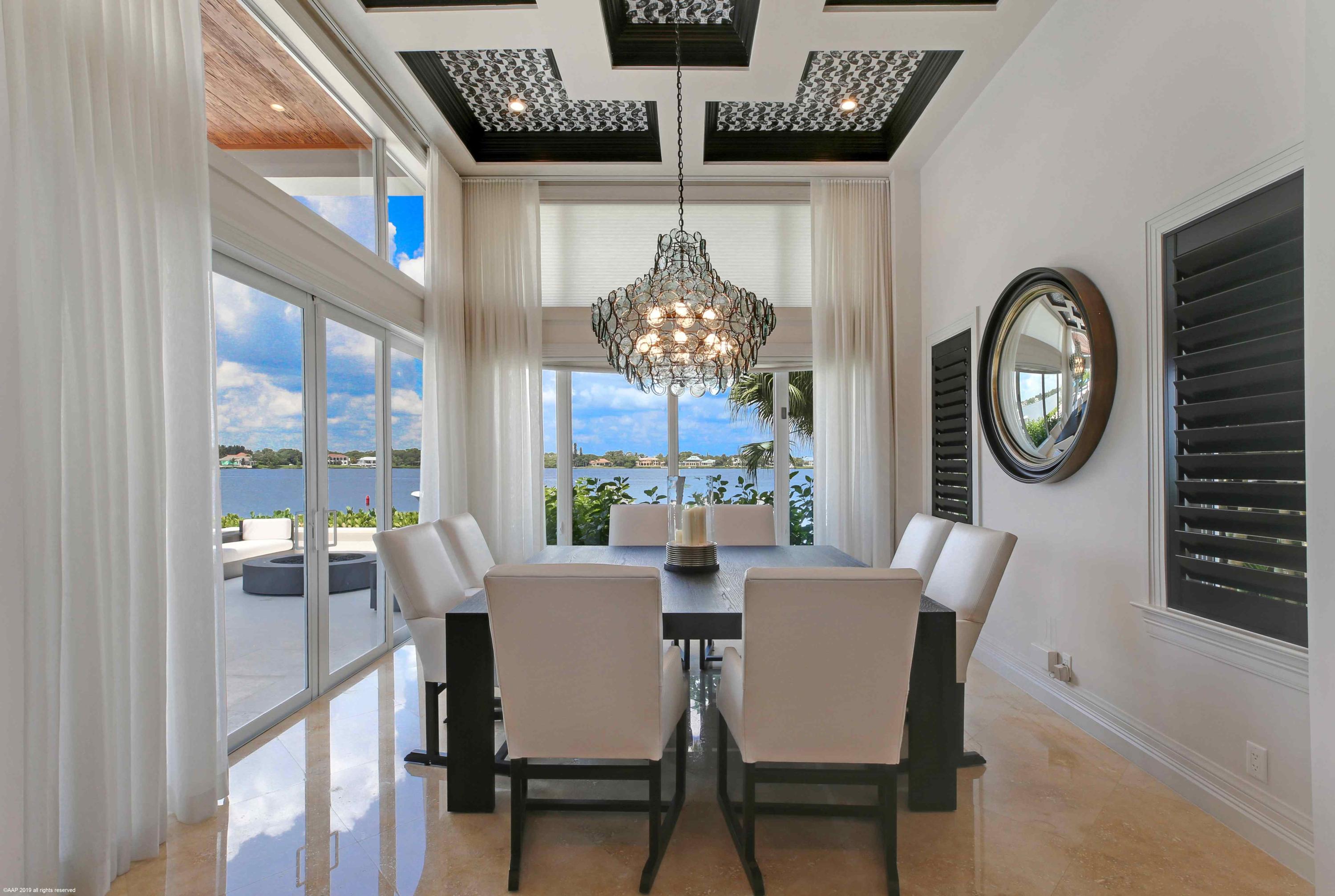 263 River Drive Tequesta, FL 33469 - Photo 31 of 68 a dining room with furniture and window