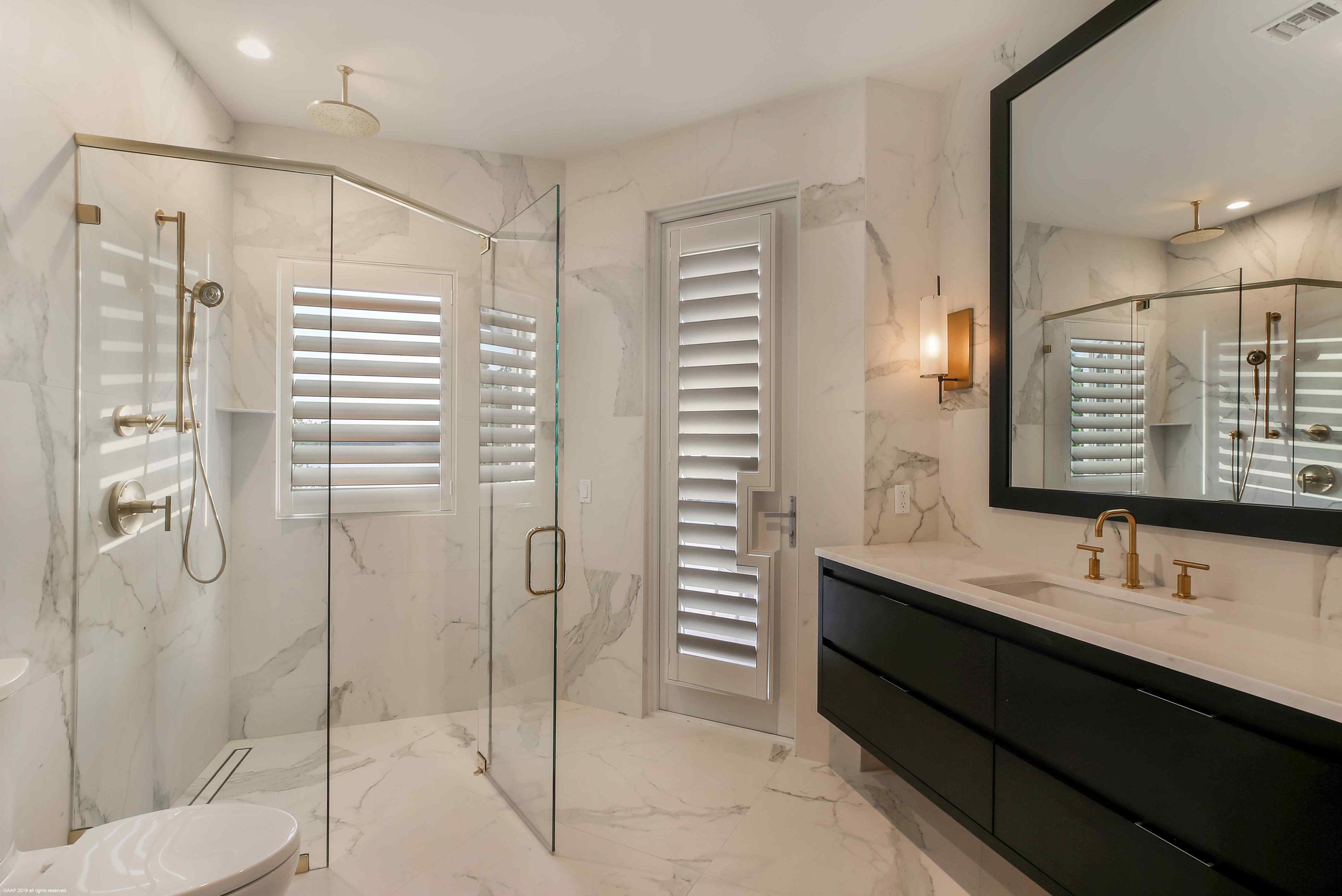 263 River Drive Tequesta, FL 33469 - Photo 40 of 68 a bathroom with a shower sink and mirror