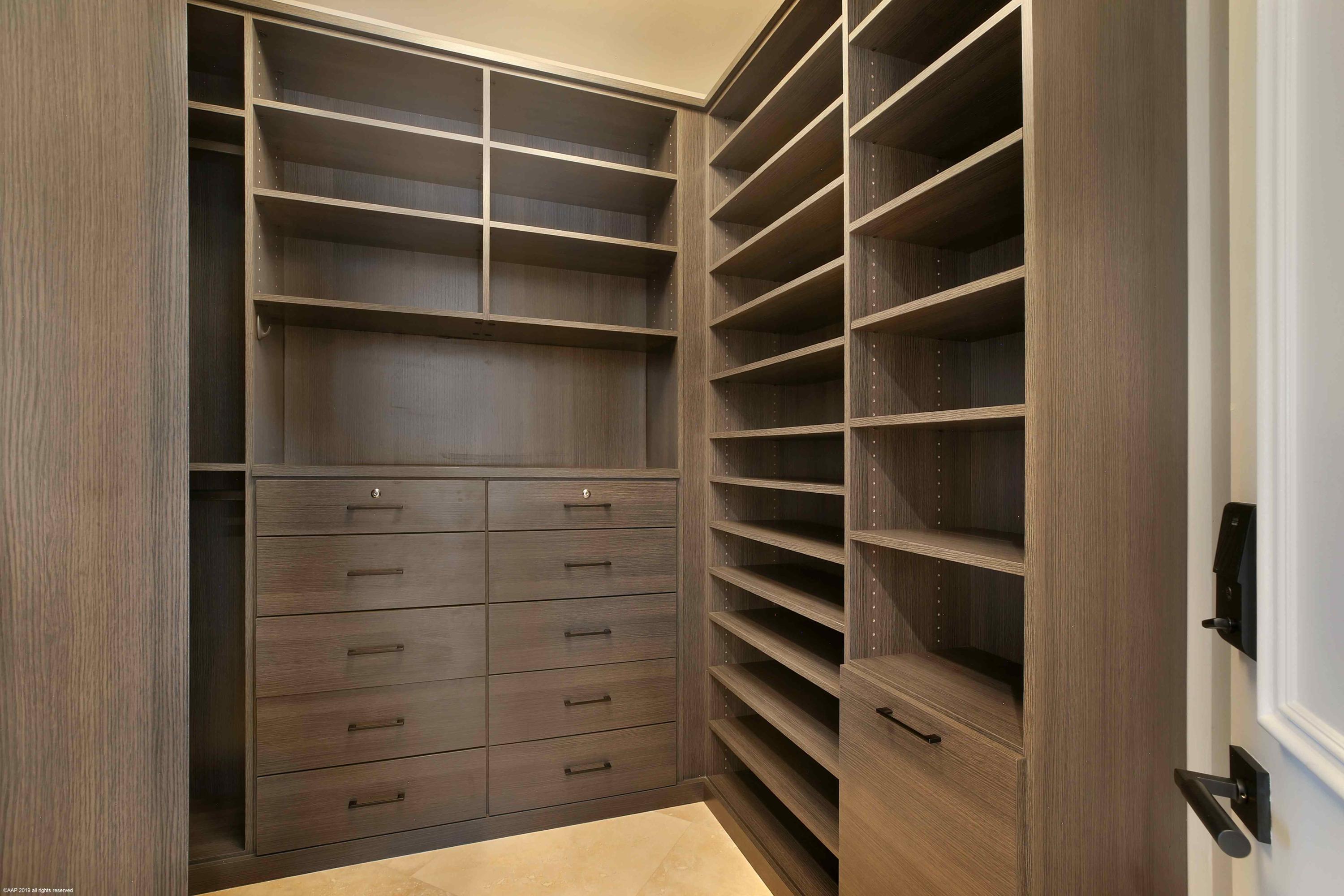 263 River Drive Tequesta, FL 33469 - Photo 41 of 68 a view of walk in closet with clothes and shoes