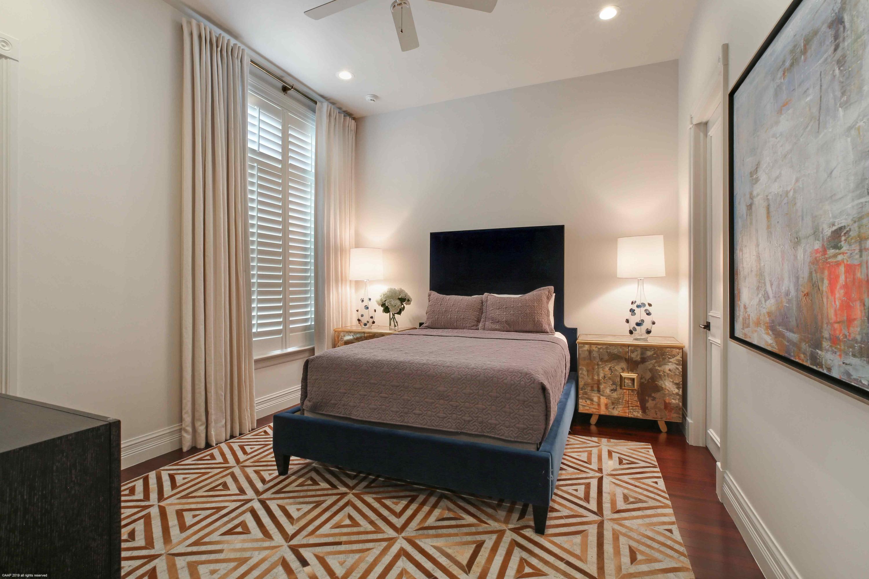 263 River Drive Tequesta, FL 33469 - Photo 43 of 68 a bedroom with a bed and a window