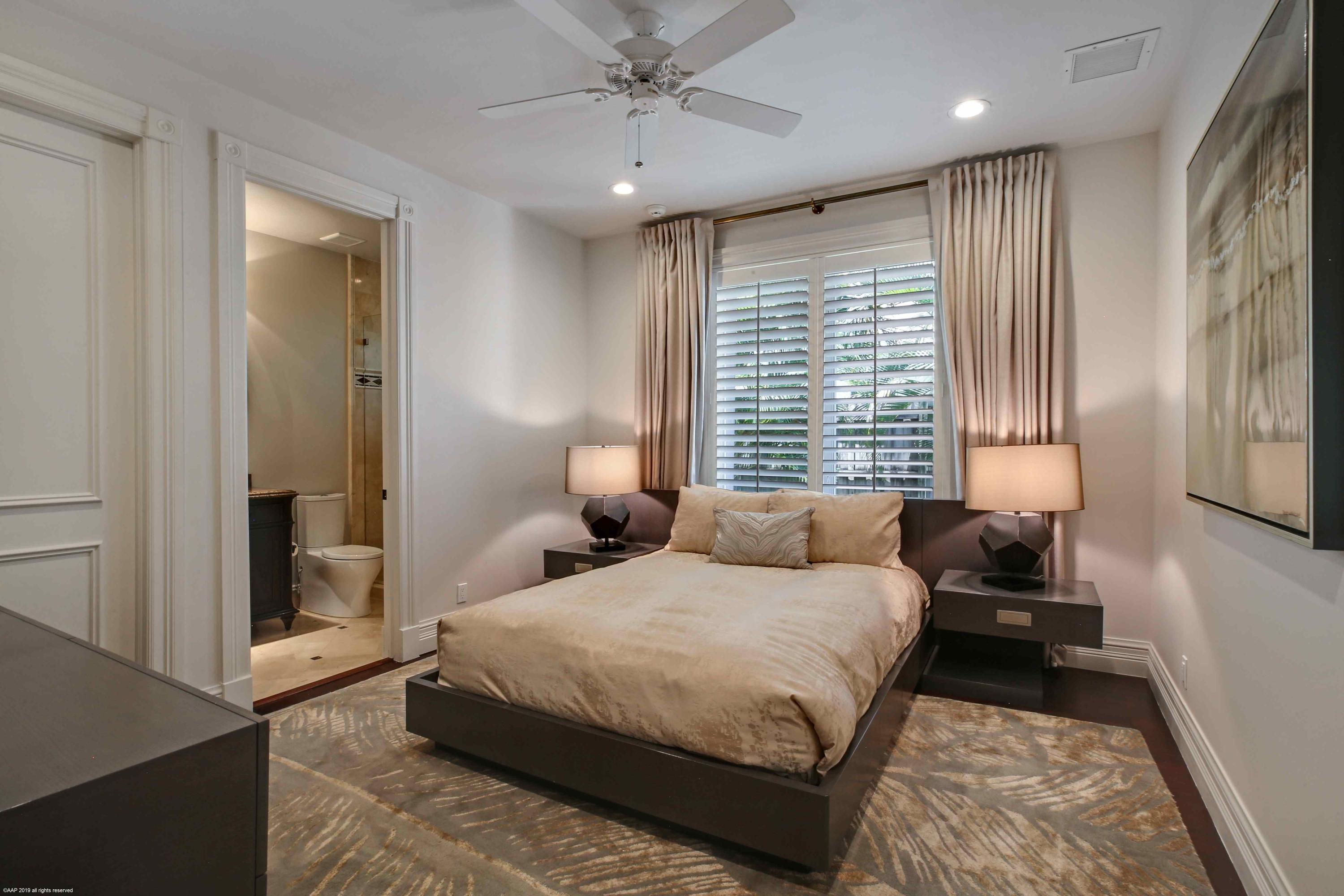 263 River Drive Tequesta, FL 33469 - Photo 46 of 68 a bedroom with a bed and a window