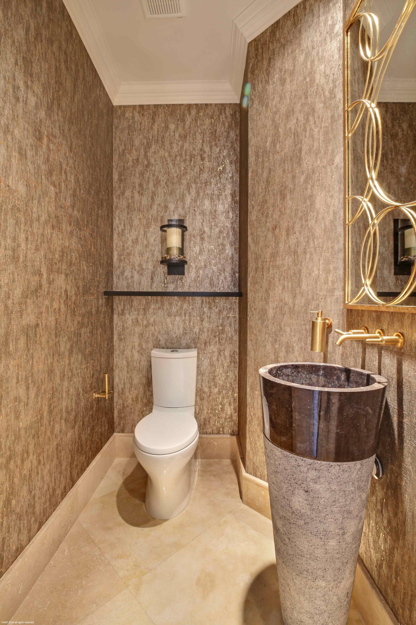 263 River Drive Tequesta, FL 33469 - Photo 50 of 68 a bathroom with a toilet and a sink