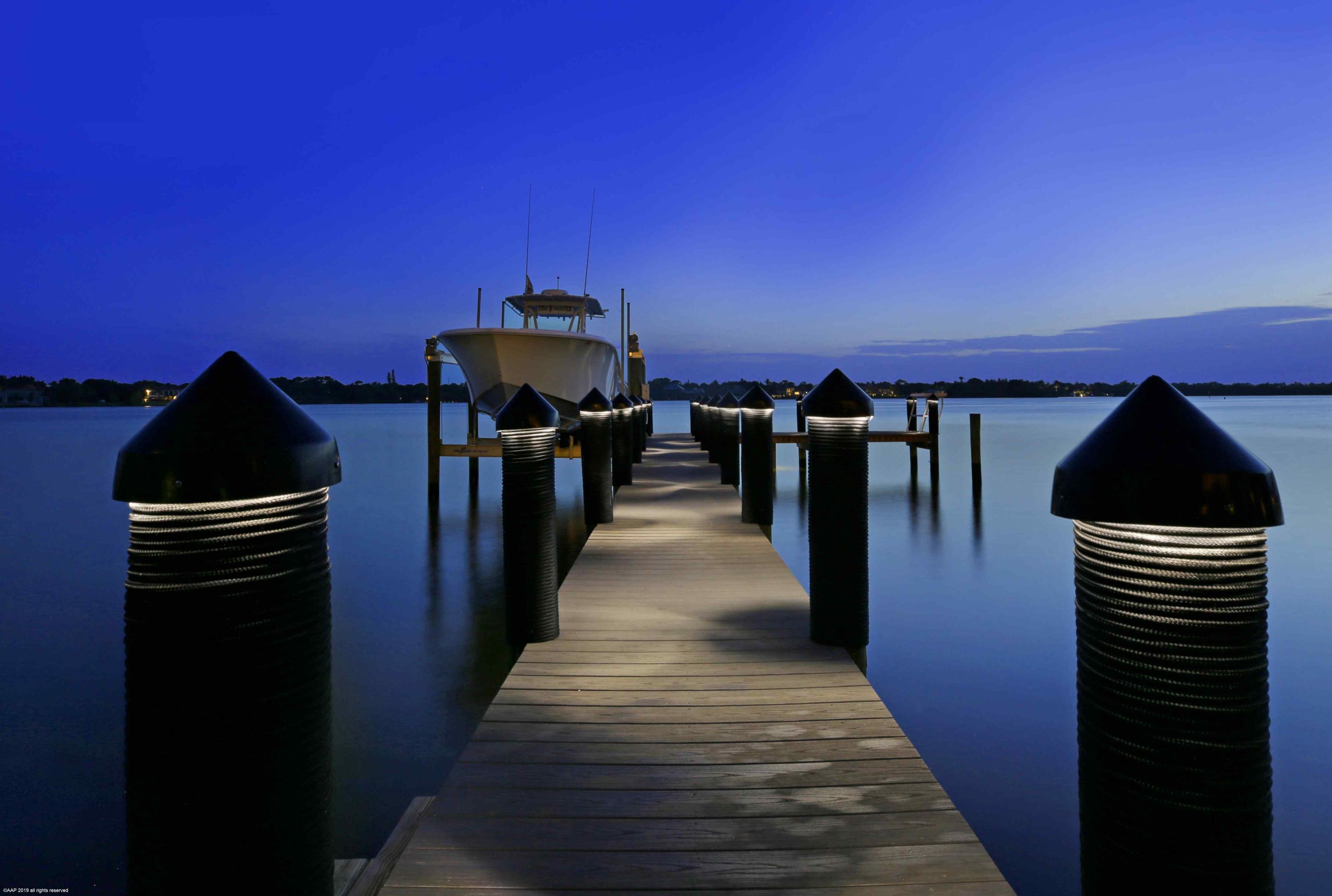 263 River Drive Tequesta, FL 33469 - Photo 61 of 68 a view of a patio in front of a house