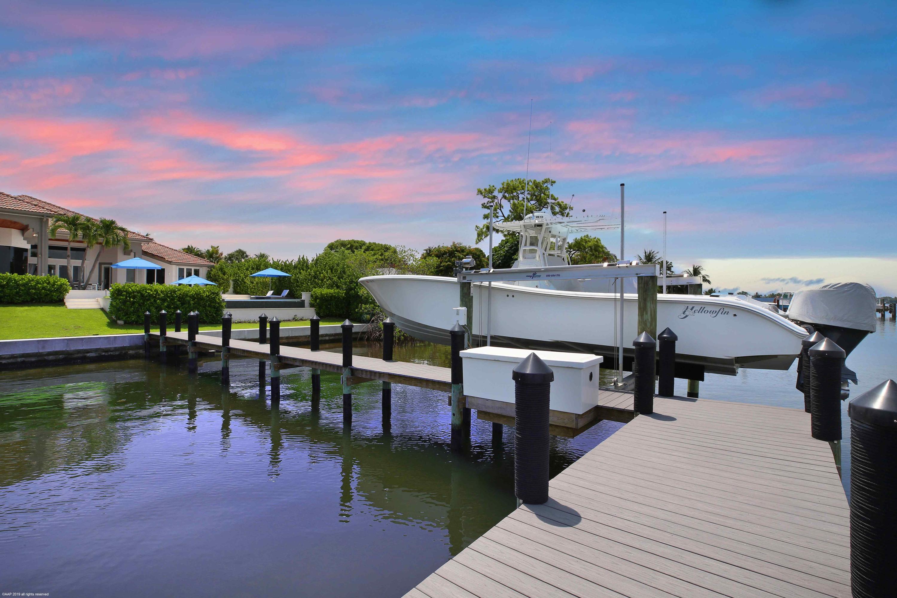 263 River Drive Tequesta, FL 33469 - Photo 63 of 68 a view of a chairs and table on the terrace