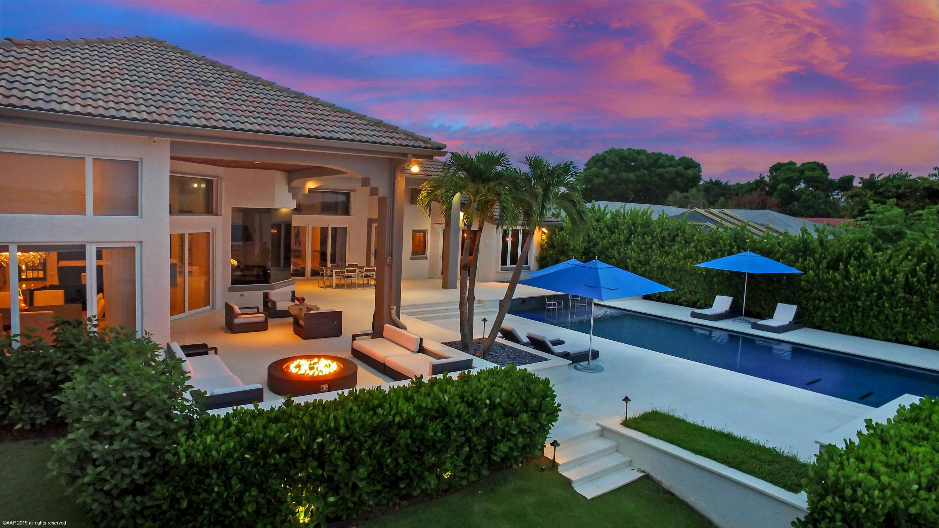 263 River Drive Tequesta, FL 33469 - Photo 8 of 68 an outdoor space with patio lots of furniture and garden