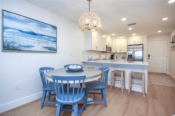 a dining room with furniture and window