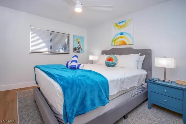 a bedroom with bed and a window