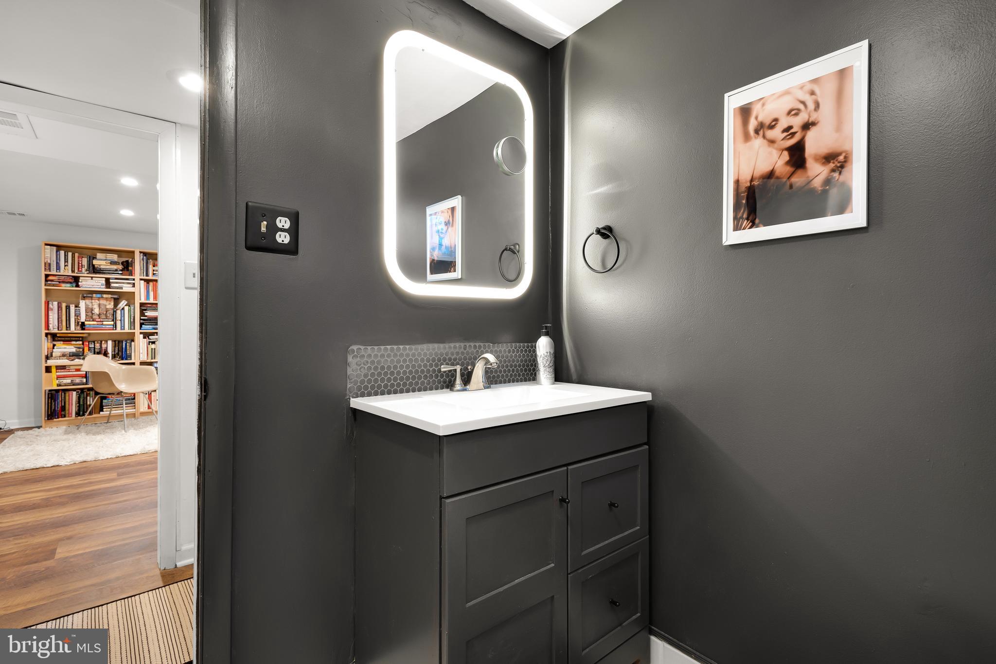 11504 Newport Mill Road Silver Spring, MD 20902 - Photo 27 of 41 a bathroom with a sink and a mirror