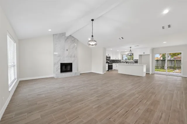 a view of a kitchen with a sink and a stove top oven