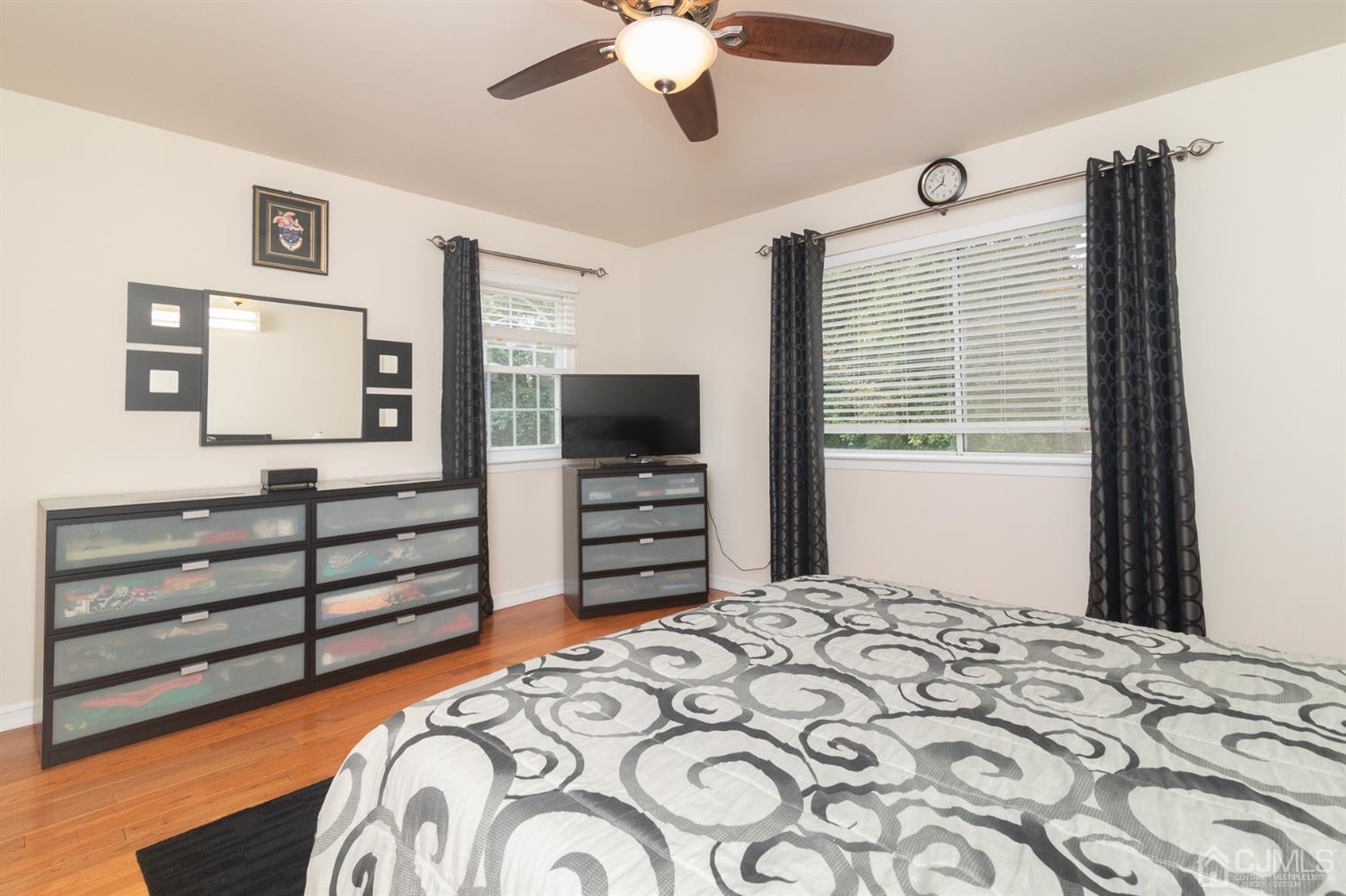5 Avery Drive Old Bridge, NJ 08857 - Photo 22 of 32 a bedroom with a bed and a flat tv screen