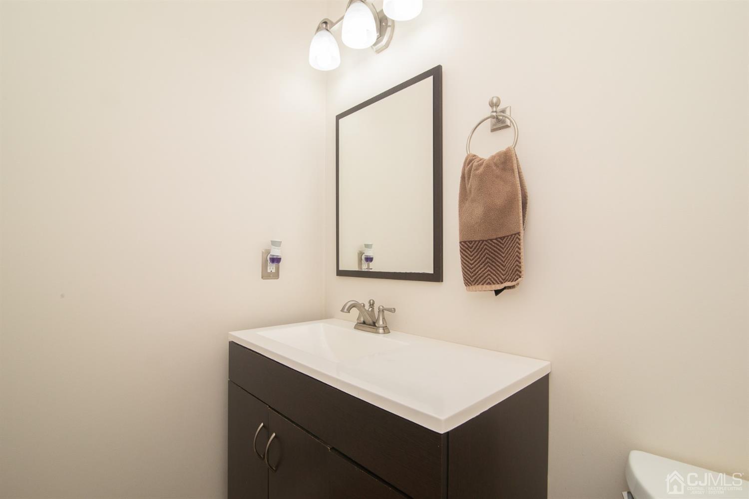 5 Avery Drive Old Bridge, NJ 08857 - Photo 28 of 32 a bathroom with a sink vanity and a mirror