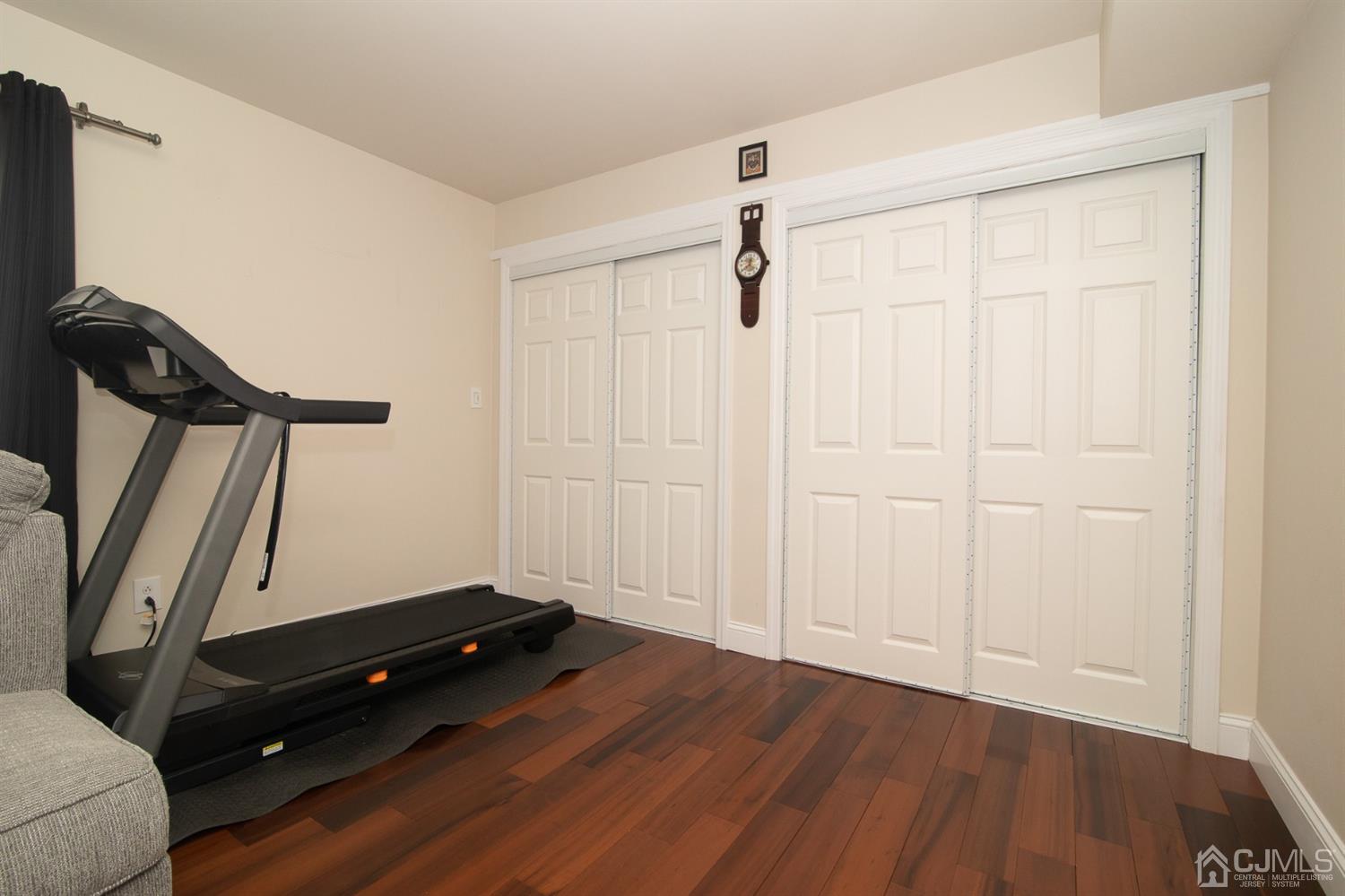 5 Avery Drive Old Bridge, NJ 08857 - Photo 30 of 32 an empty room with wooden floor and white walls