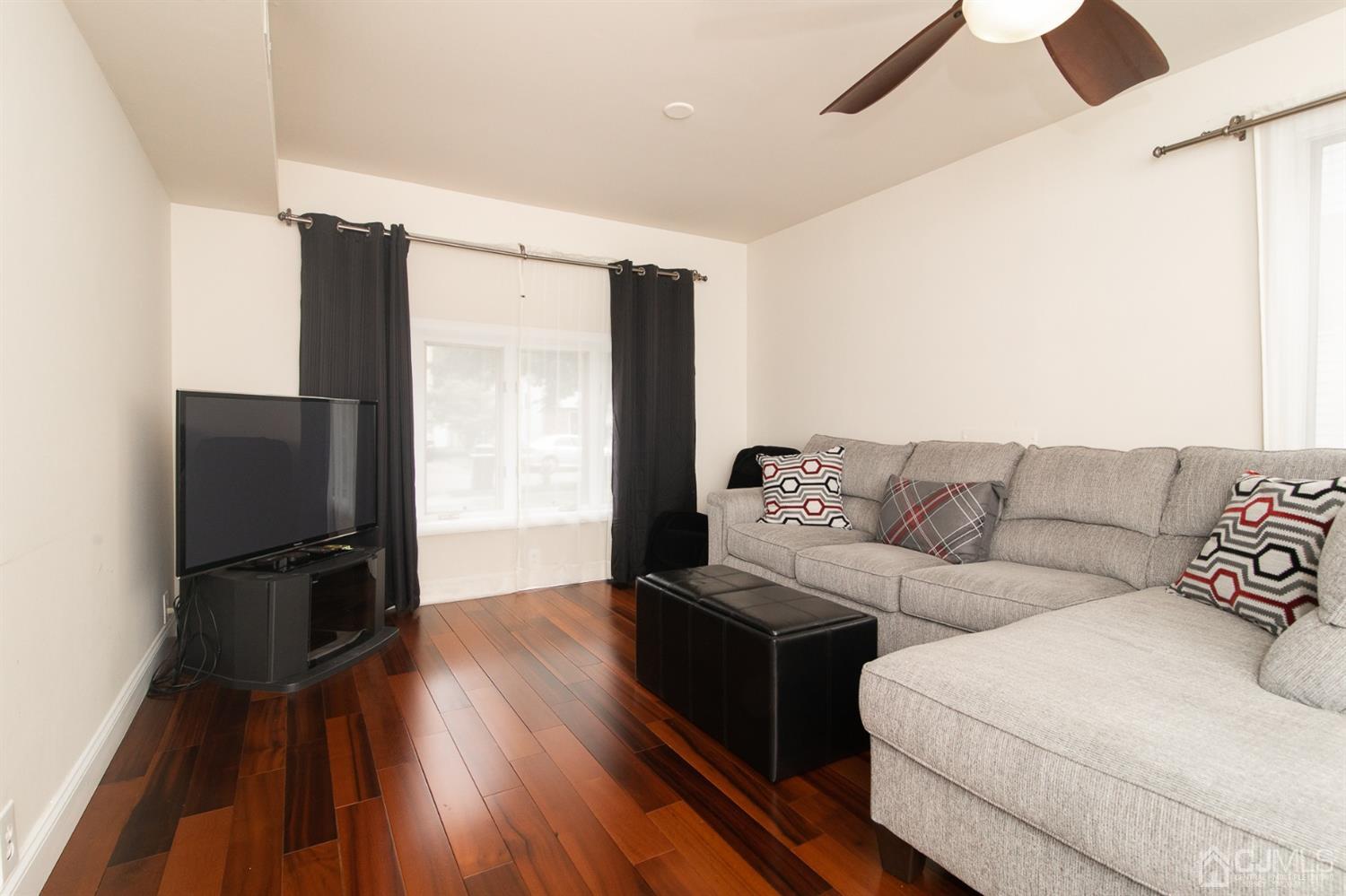 5 Avery Drive Old Bridge, NJ 08857 - Photo 31 of 32 a living room with furniture and a flat screen tv