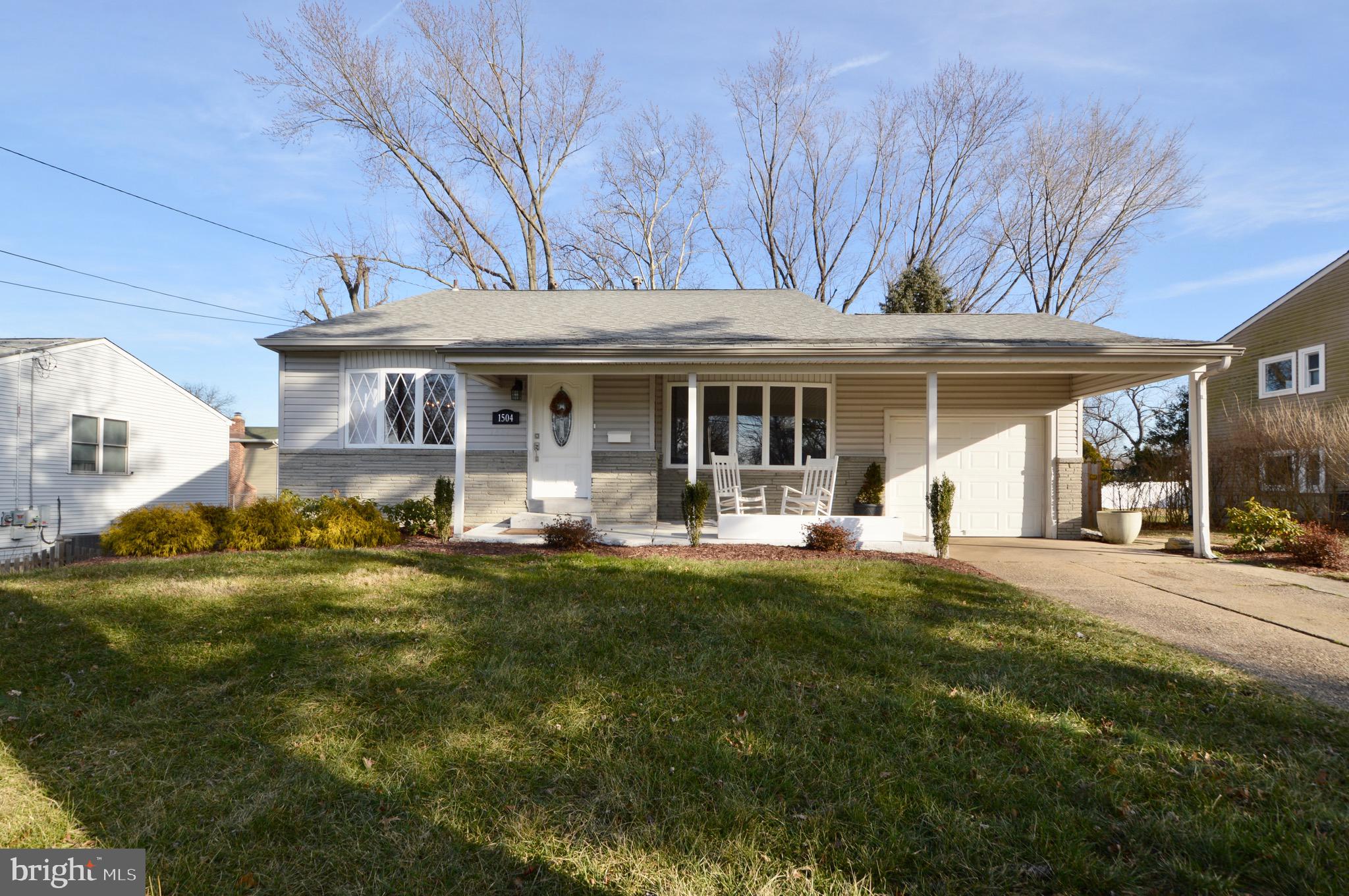 a view of a house with a yard patio and slide