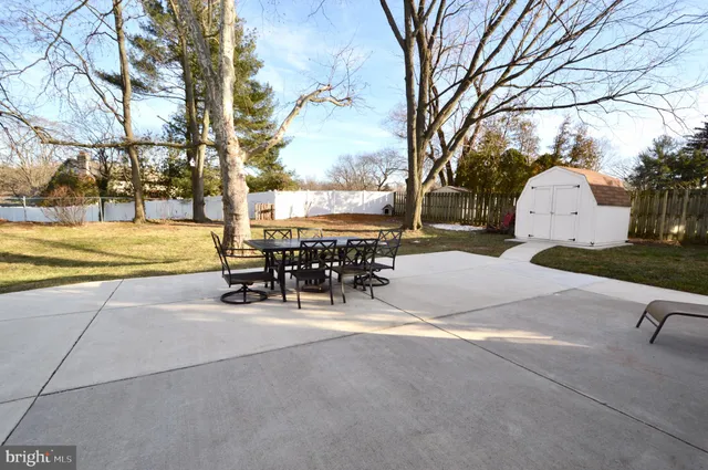 a view of a park with iron fence