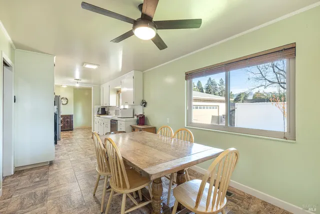 a kitchen with a refrigerator and a sink