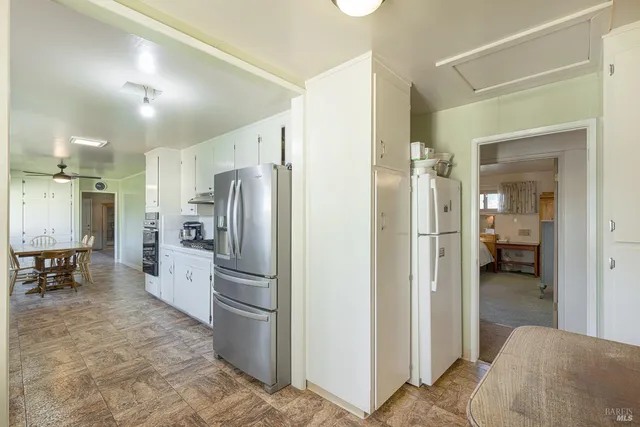 a bathroom with a double vanity sink a mirror and shower