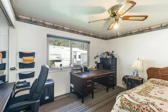 a bedroom with a bed and window