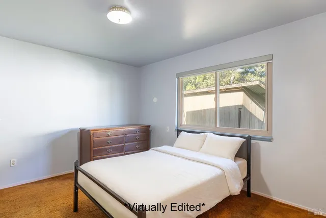 a view of an empty room with a fireplace