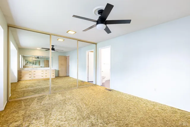 a view of parking garage with cars