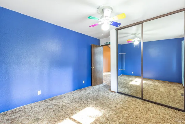 a bathroom with a sink mirror and toilet