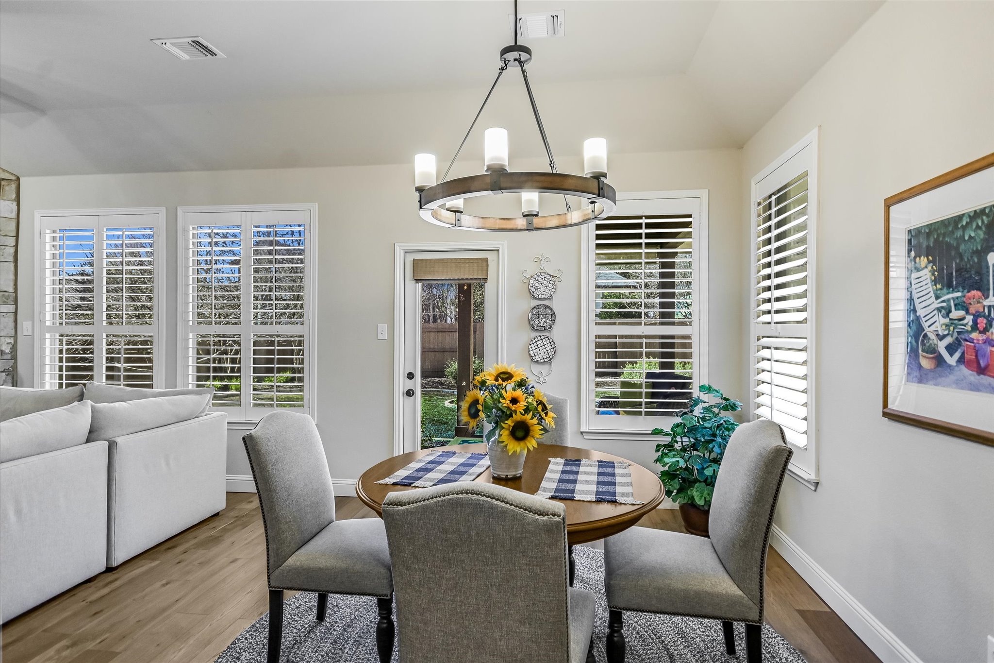 409 Harris Drive Austin, TX 78737 - Photo 10 of 29 a dining room with furniture a chandelier and window