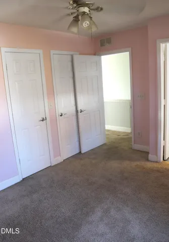 a bathroom with a toilet and a bathtub