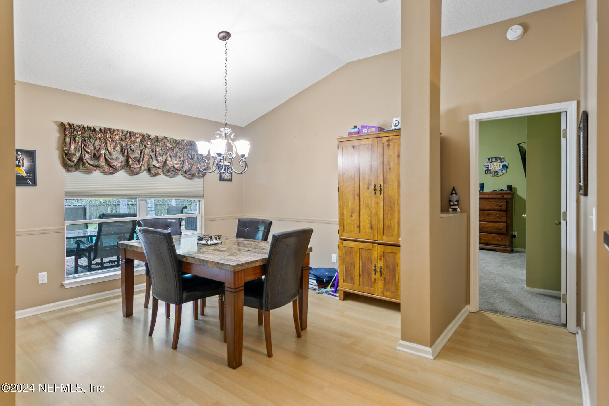 809 Mill Pond Court St. Johns, FL 32259 - Photo 13 of 50 a view of a dining room with furniture window and wooden floor