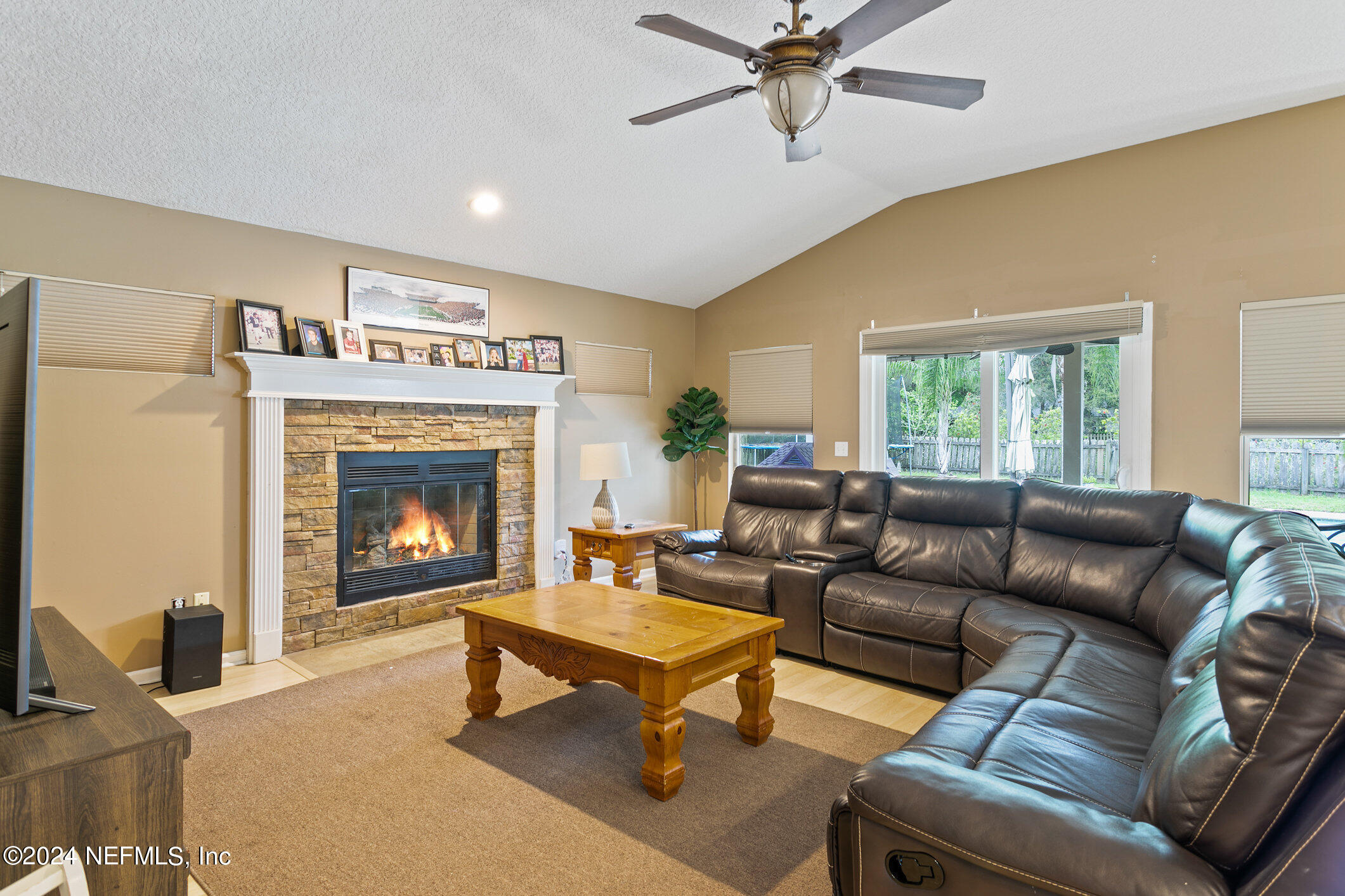 809 Mill Pond Court St. Johns, FL 32259 - Photo 15 of 50 a living room with furniture and a fireplace
