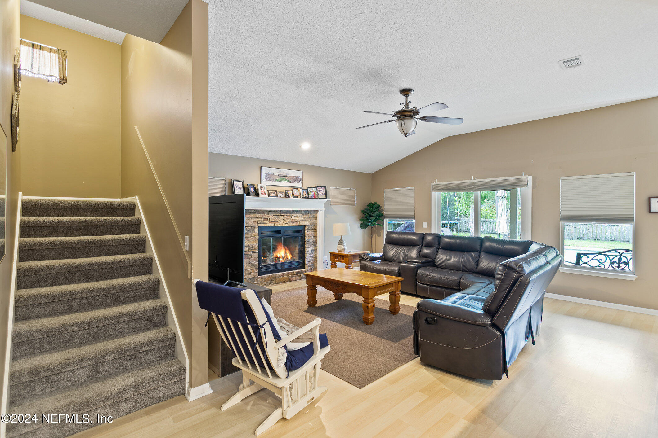 809 Mill Pond Court St. Johns, FL 32259 - Photo 16 of 50 a living room with furniture and a fireplace