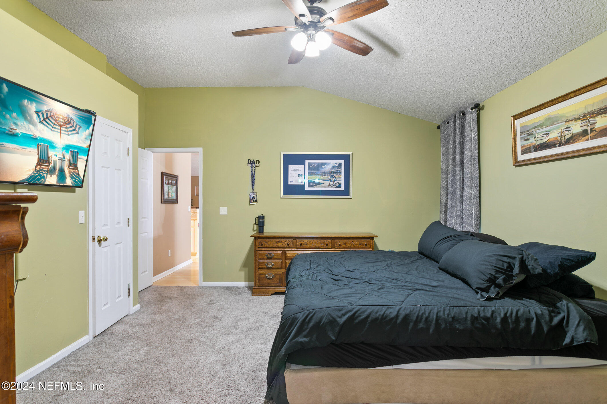809 Mill Pond Court St. Johns, FL 32259 - Photo 18 of 50 a bedroom with a bed and a flat screen tv