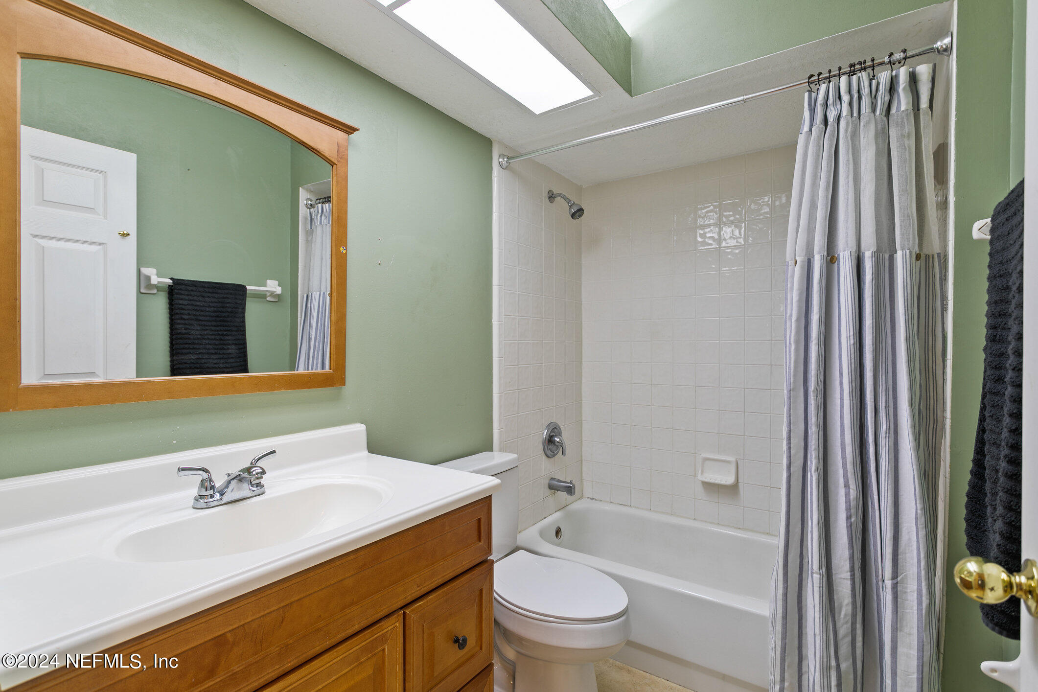 809 Mill Pond Court St. Johns, FL 32259 - Photo 23 of 50 a bathroom with a granite countertop sink toilet and shower