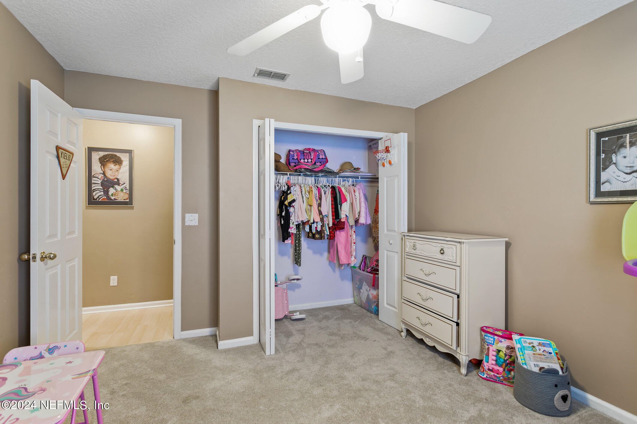 809 Mill Pond Court St. Johns, FL 32259 - Photo 25 of 50 a view of a livingroom with fridge and closet