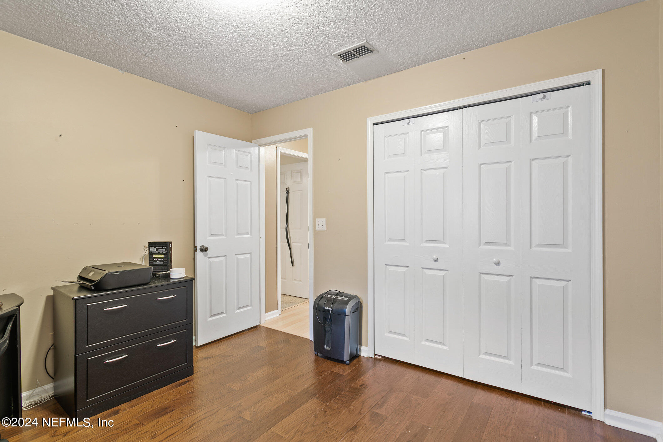 809 Mill Pond Court St. Johns, FL 32259 - Photo 27 of 50 a view of an empty room and wooden floor