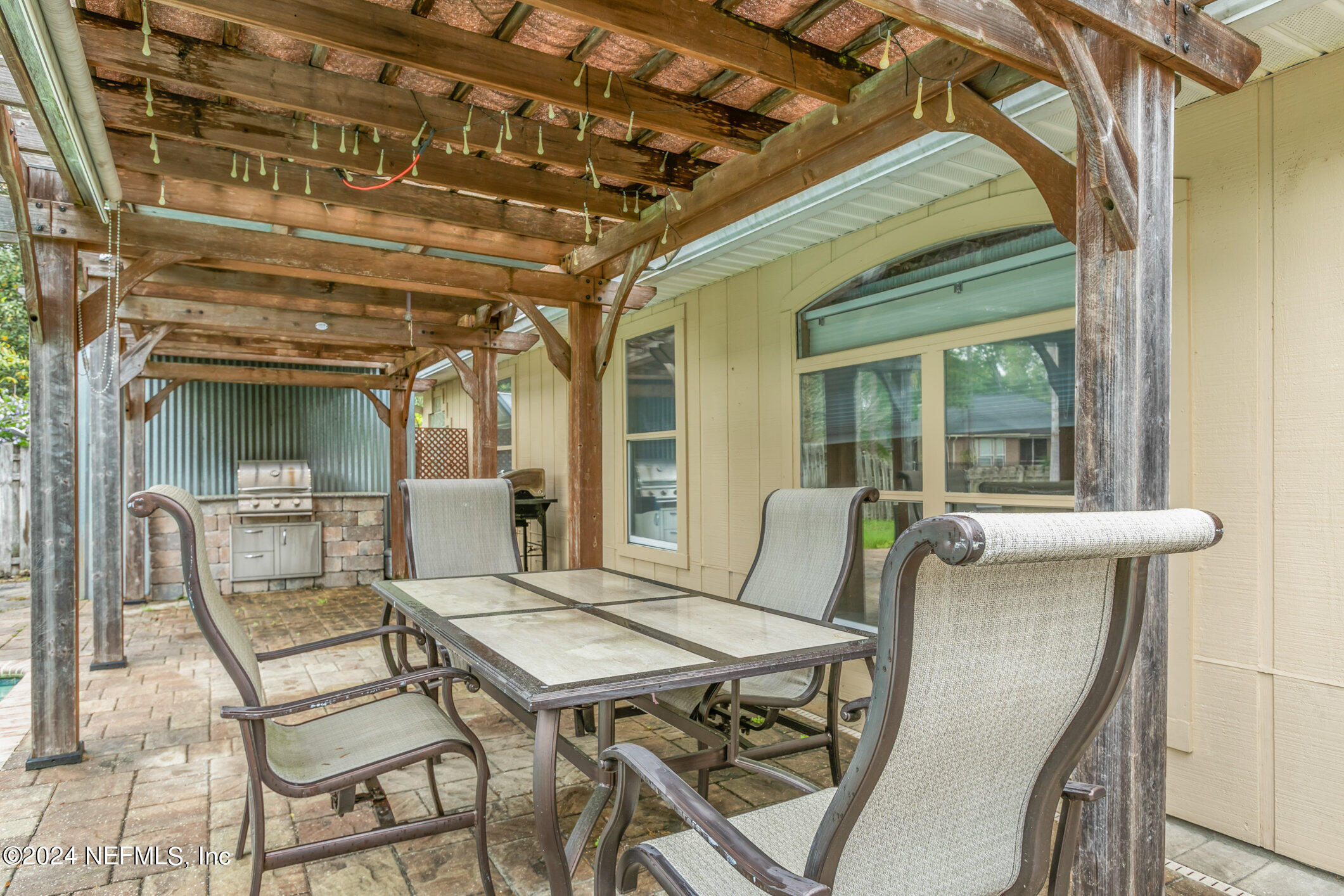 809 Mill Pond Court St. Johns, FL 32259 - Photo 31 of 50 a view of a patio with a table and chairs