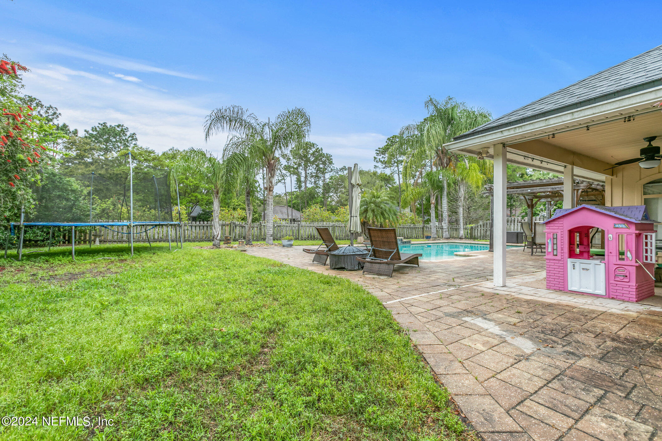 809 Mill Pond Court St. Johns, FL 32259 - Photo 34 of 50 a view of a backyard with a garden and entertaining space
