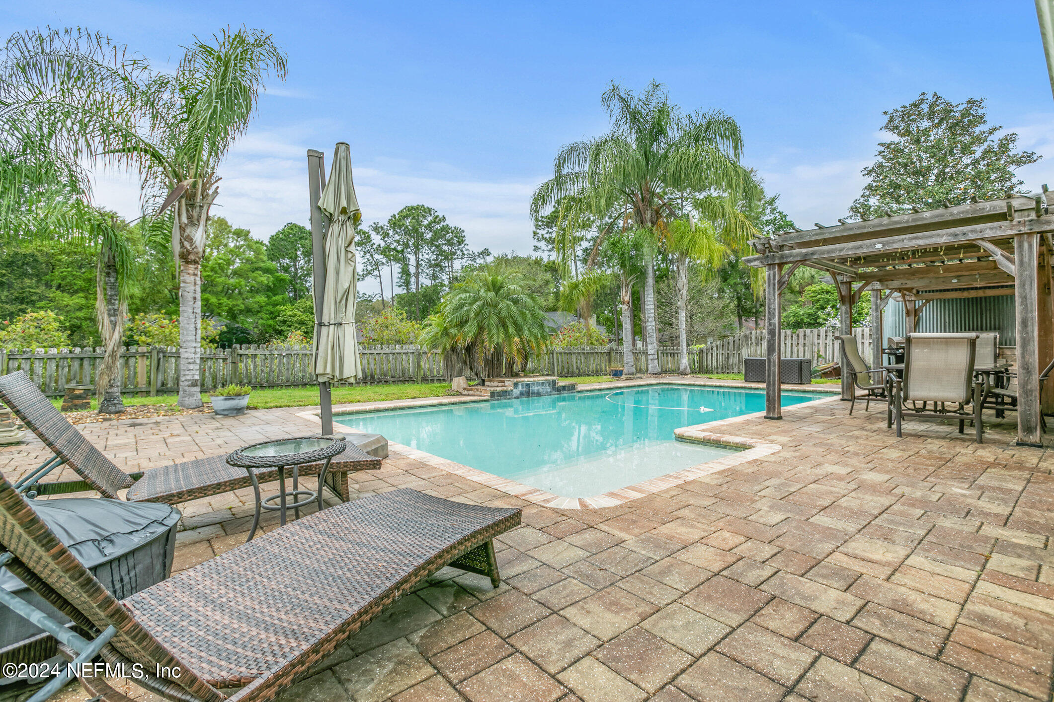 809 Mill Pond Court St. Johns, FL 32259 - Photo 35 of 50 a view of a patio with a table and chairs