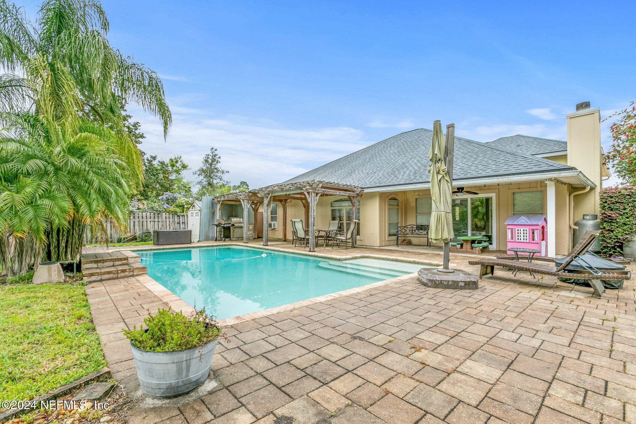 809 Mill Pond Court St. Johns, FL 32259 - Photo 36 of 50 a front view of a house with garden