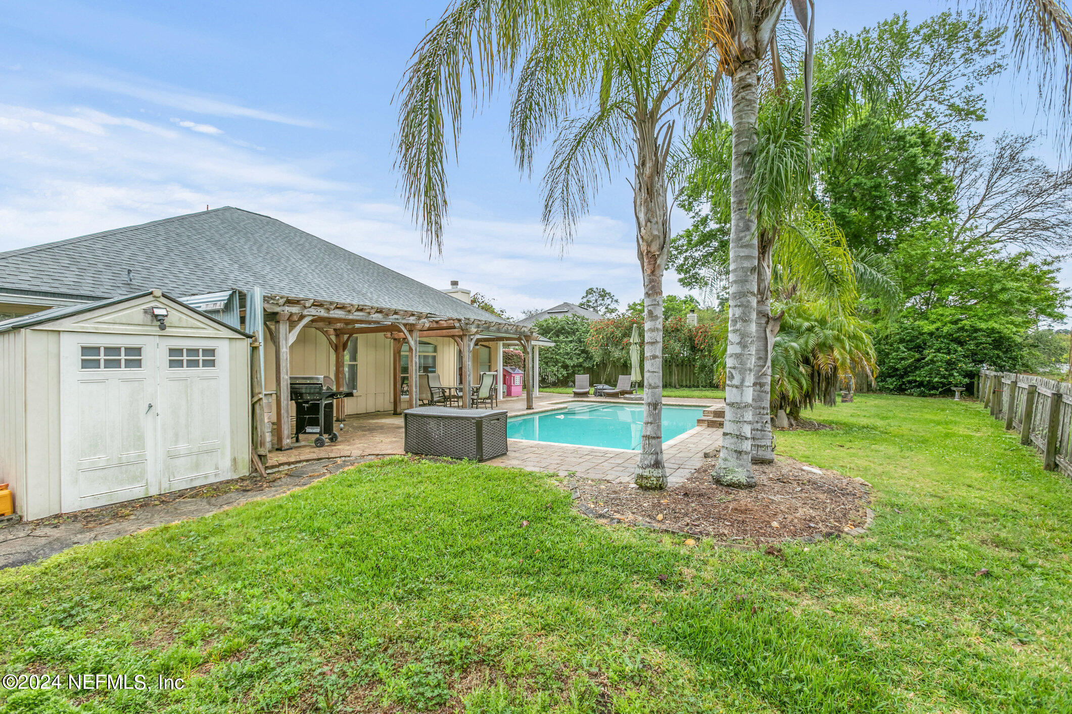 809 Mill Pond Court St. Johns, FL 32259 - Photo 39 of 50 a view of a house with backyard and a patio