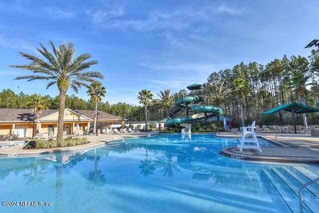 809 Mill Pond Court St. Johns, FL 32259 - Photo 43 of 50 a view of a swimming pool with lounge chairs