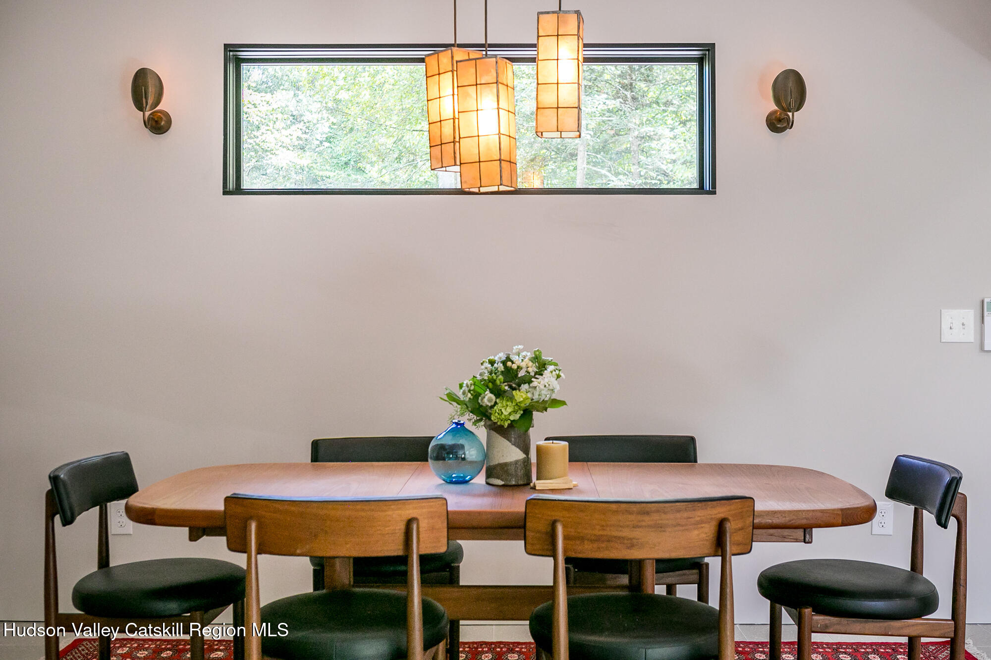 35 Fern Hollow Road Stone Ridge, NY 12484 - Photo 13 of 40 a view of a dining room with furniture and a potted plant