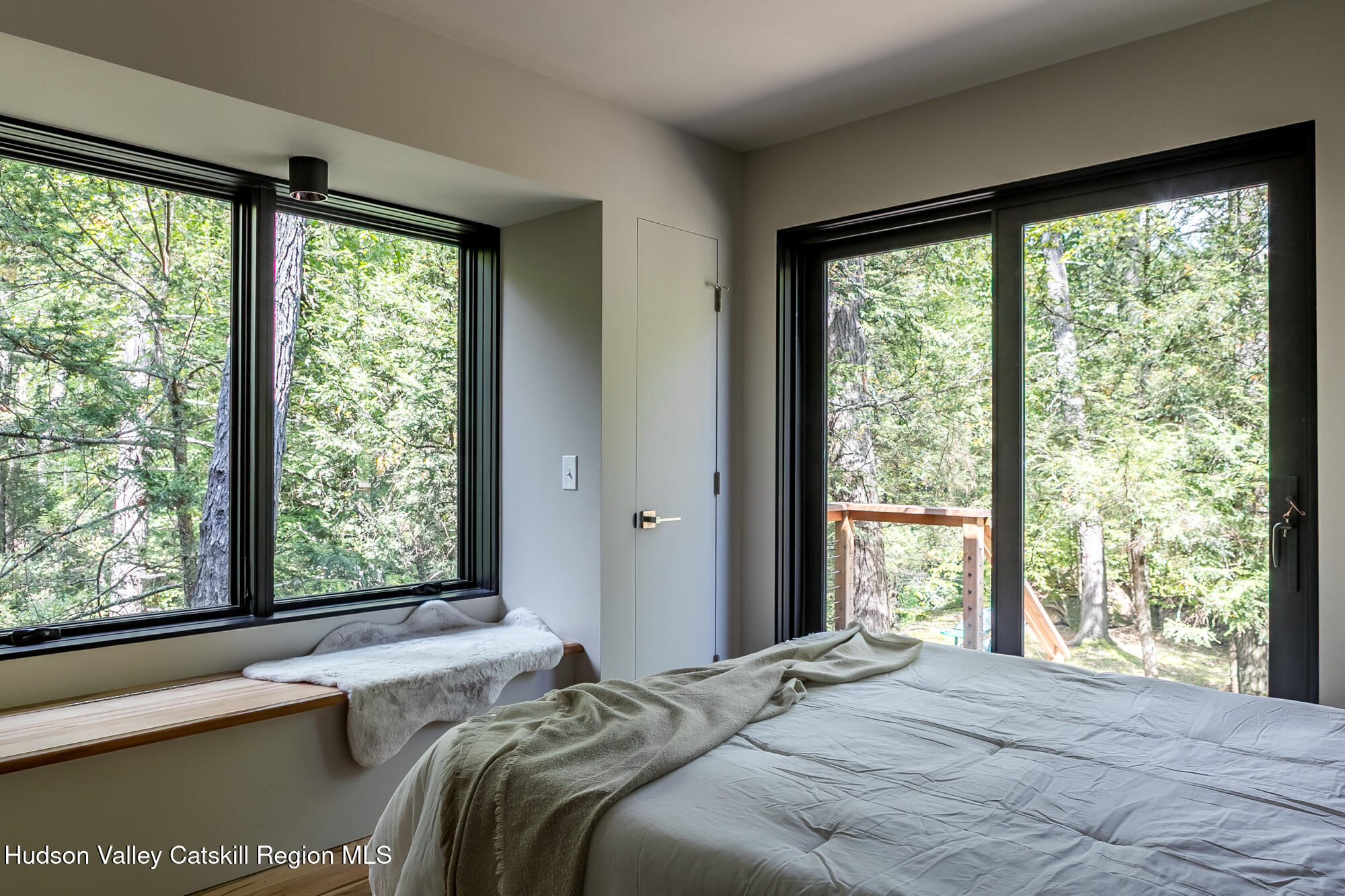 35 Fern Hollow Road Stone Ridge, NY 12484 - Photo 15 of 40 a bedroom with a bed and a large window