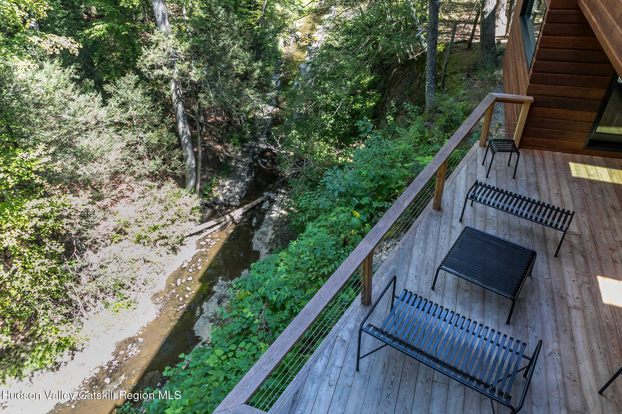 35 Fern Hollow Road Stone Ridge, NY 12484 - Photo 30 of 40 a balcony with wooden floor and trees in the back