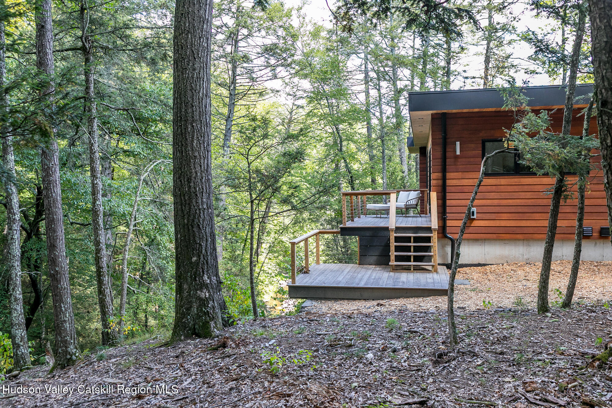 35 Fern Hollow Road Stone Ridge, NY 12484 - Photo 31 of 40 a view of a house with backyard and a trees