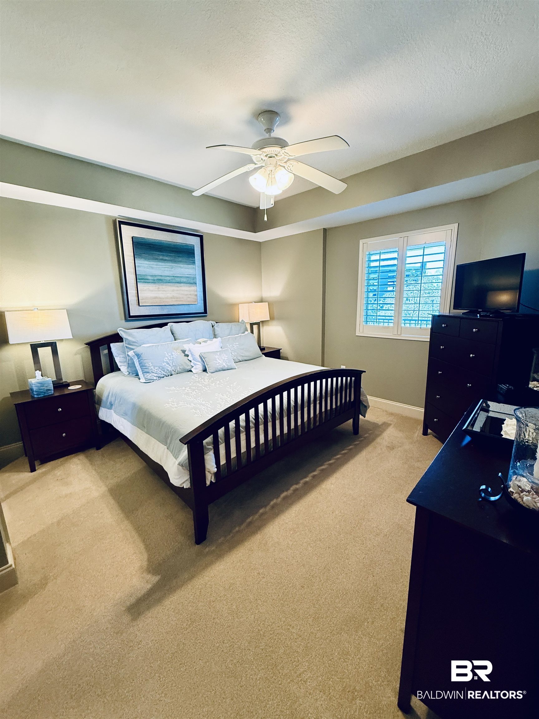 27800 Canal Road, Unit 409 Orange Beach, AL 36561 - Photo 9 of 22 Bedroom featuring light carpet and a ceiling fan